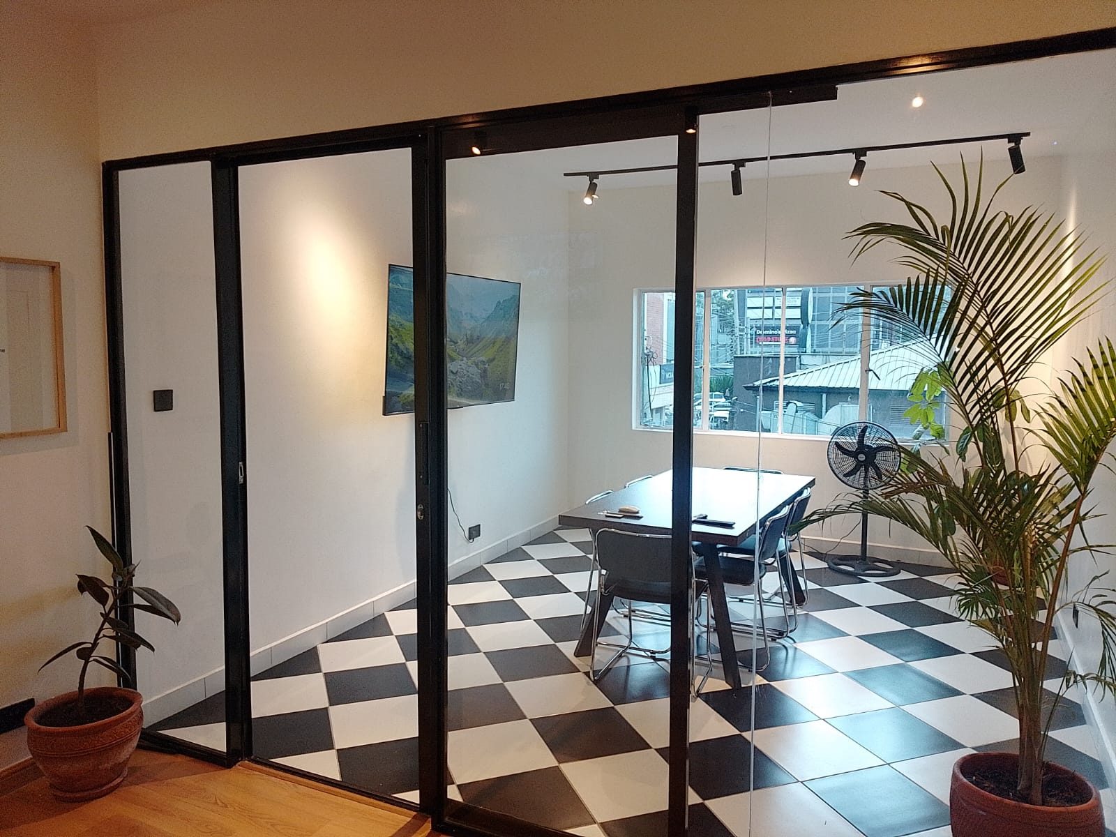 Suite A6 boardroom through glass partition